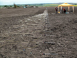 Fig. 9 Fidvár near Vráble 2007: geoelectric series of measurements through the settlement mound and ditch (photograph: Hecht).